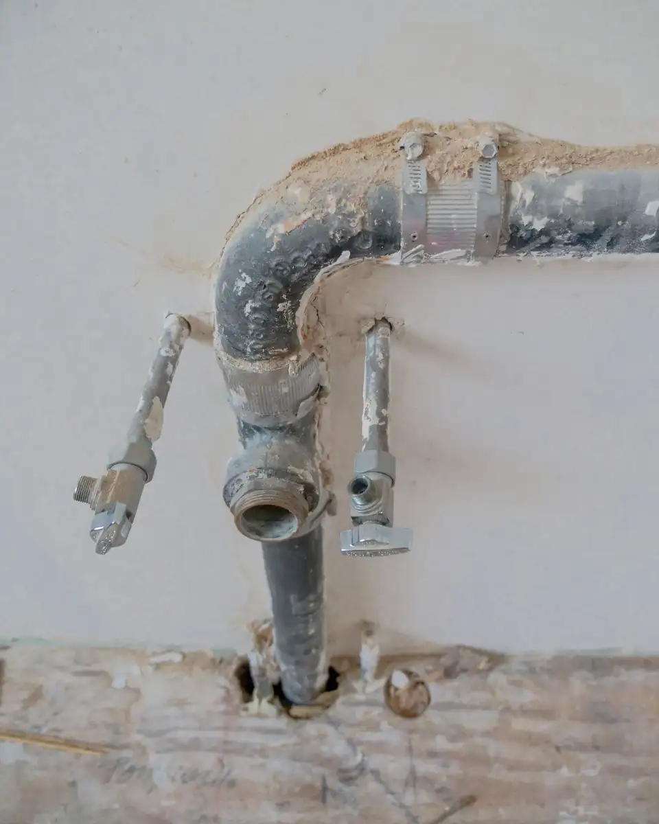 Old galvanized line found behind plaster